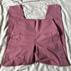Pink athletic leggings with pockets